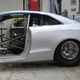 Illustration for article titled Watch an Audi A5 transform into a drag car